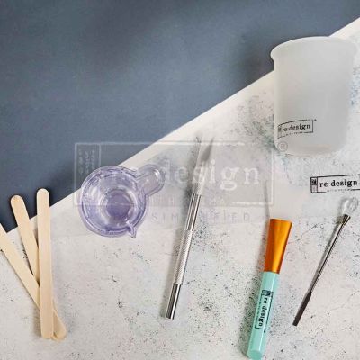 Resin Tool Set – 18 pcs – 1 silicone mat (11.75″x8.25″) + 1 silicone measuring cup (100ml) + 10 mixing cups + 3 stir sticks + 1 muddler + 1 silicone brush + 1 carving knife
